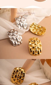 Detail view of woven texture on 18K gold and silver plated chunky rings in a set