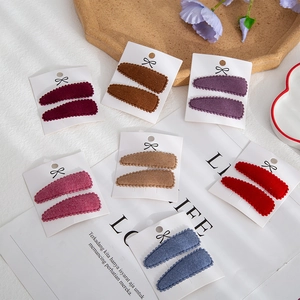 Detailed set of teardrop snap hair clips in faux cashmere fabric for kids and women