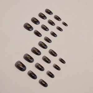 Brown cat eye square press-on nails with amber tones and translucent grey tips