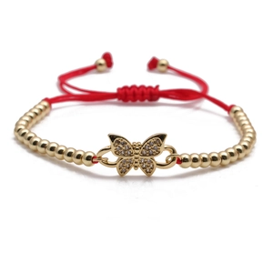 Adjustable red cord bracelet with gold beads and a sparkling butterfly centerpiece