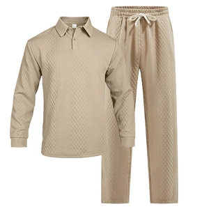 Detail of men's beige long sleeve polo set featuring textured waffle weave fabric
