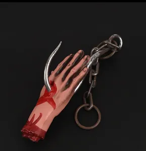 Realistic bloody severed hand prop with metal hook and chain for Halloween haunt decor