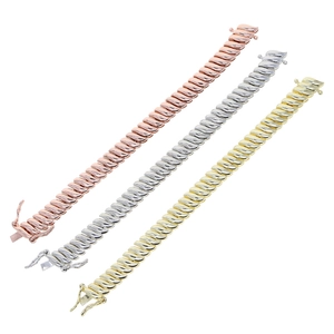 Detail view of 10mm wide tennis chains in rose gold, silver, and gold leaf-link designs