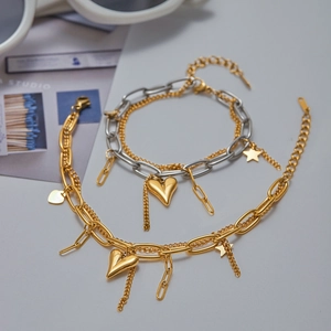 Dual-layer gold heart and star charm bracelet in premium stainless steel finish
