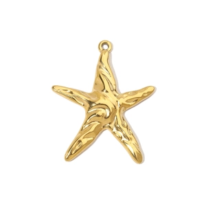 Macro shot of gold starfish pendant with hammer-textured surface and metallic shine