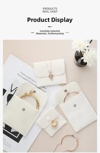 Detailed view of various sizes of premium beige velvet jewelry pouches with snap buttons