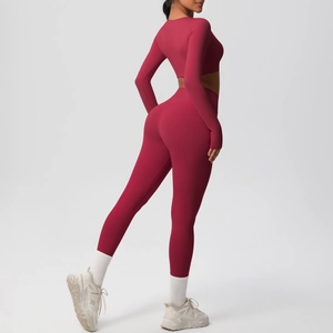 Back view of deep berry yoga set featuring long sleeve crop top and high waist leggings