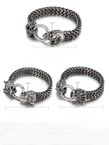 Detail of punk stainless steel bracelets with skull, wolf, and lion head charms