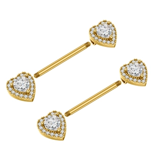 Close-up of heart-shaped gold nipple rings with sparkling zircon inlay and screw closure