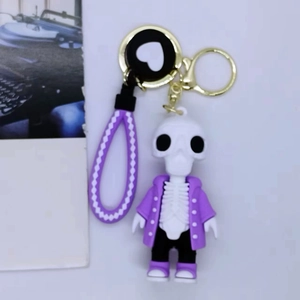 Cartoon skeleton keychain with purple jacket and matching braided wristband charm