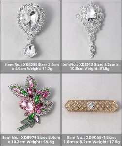 Detailed view of luxury crystal brooches in various geometric and floral leaf shapes