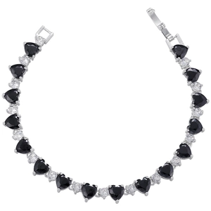 Detail of silver heart bracelet featuring black heart-shaped zircons and fold-over clasp