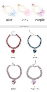 Close-up of pet pearl collars and rhinestone heart pendants with adjustable chains