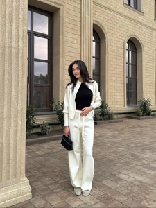 Women's white waffle knit tracksuit with zip-up cardigan and drawstring wide-leg pants