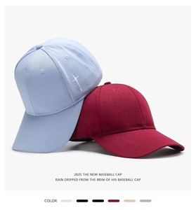 Detailed view of baseball cap texture featuring star embroidery and twill cotton fabric