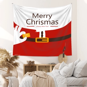 Cozy bedroom setting showing a Christmas tapestry with Santa suit design and festive text