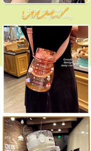 Detail of large capacity water bottle with cute stickers and adjustable pink shoulder strap
