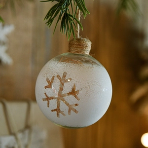 8cm glass Christmas ball with snowflake pattern hanging on pine branch with jute rope