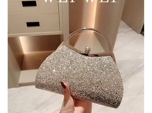 Close-up of champagne sequined evening clutch bag with elegant metallic ring handle