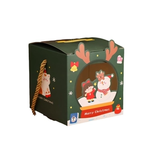 Green Christmas gift box with reindeer horn cutout, gold handle and snowman window