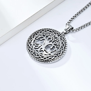 Detail of silver tree of life pendant with intricate Celtic knot hollowed edges