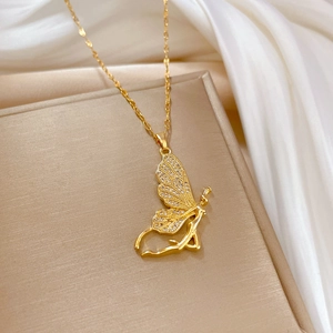 Elegant gold butterfly fairy necklace with clear zircon wings on luxury silk background