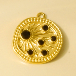 Detailed view of 18k gold plated stainless steel sunburst pendant with black rhinestones