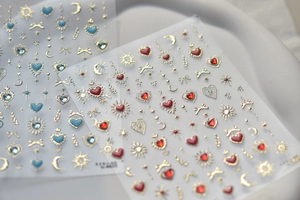 Macro detail of luxury nail art stickers with gold stars moons and colorful gems