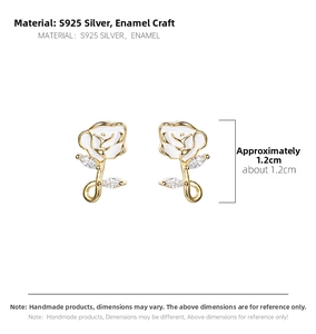 Detail of S925 silver rose earrings with gold edges, white enamel, and marquise zircon accents
