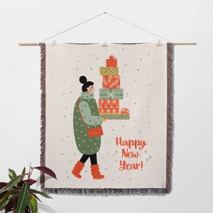 Detail of woven Christmas tapestry with woman holding gifts and colorful fringe edges