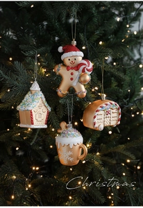 Gold Christmas ornaments set featuring gingerbread man and camper on tree branches