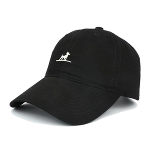 Detail of black cotton baseball cap with white dog embroidery and six-panel structure