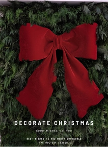 Close-up of a large red velvet Christmas bow featuring soft texture and festive details