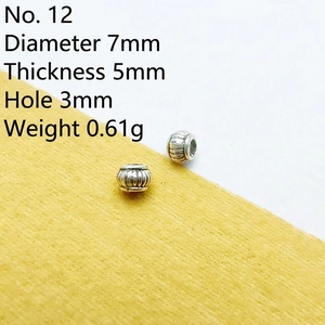 Detailed view of No.12 vintage silver spacer beads with vertical texture for DIY jewelry