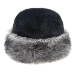 Close-up of thick faux fur bucket hat with black crown and grey plush trim detail