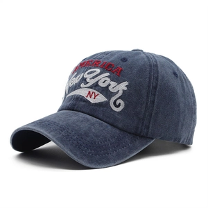 Detail of vintage washed navy cotton baseball cap with 3D embroidery and side view