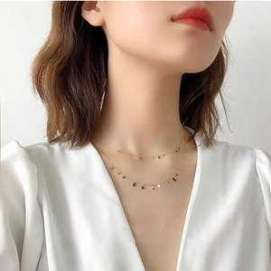 Minimalist double layer gold choker necklace with small round sequins on steel chains