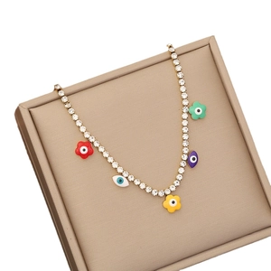 Gold evil eye necklace with colorful enamel flowers and sparkling crystal rhinestones