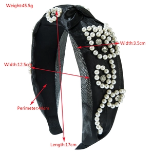 Elegant black mesh headband with white faux pearls and crystals in flower pattern