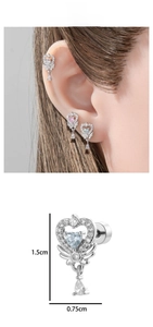 Macro detail of heart wing earring with blue zircon drop and 1.5cm size markings