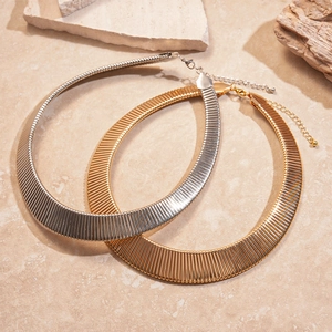 Textured metallic geometric chokers in gold and silver finish with stripe patterns