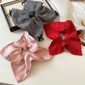 Elegant satin and checkered scrunchie set with bow detail for women's hairstyling