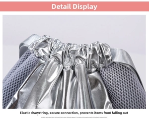 Close-up of drawstring closure on silver metallic bag showing stitching and mesh detail