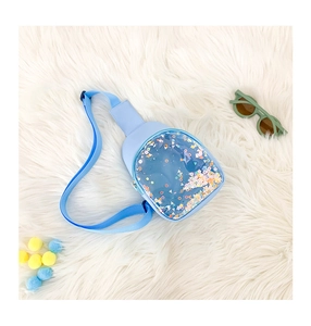 Close-up of light blue kids PVC chest bag with colorful sequins in a transparent pocket