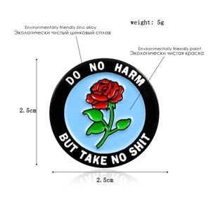 Detailed size and material specs for flower enamel pin with Do No Harm lettering