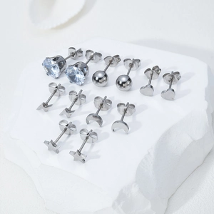 Detailed set of six pairs of silver stainless steel studs featuring stars and moons