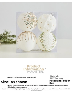 Detailed view of white Christmas ornaments with gold and green glitter line patterns