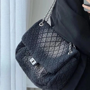Quilted denim chain shoulder bag in black washed finish with silver hardware and strap