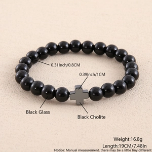 Detail view of black glass beaded bracelet with black cholite cross and size specifications