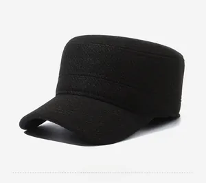 Detail view of the black cotton flat top cadet cap with silver Sports Style metal badge